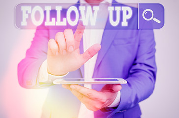 Conceptual hand writing showing Follow Up. Concept meaning a continuation of something that has...