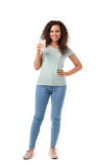 Fototapeta premium African-American woman with milk on white background