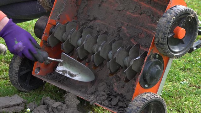 Cleaning a heavily soiled lawn aerator
