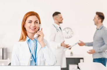 Fototapeta premium Female medical assistant working in clinic