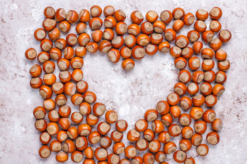 Hazelnuts on concrete background,top view