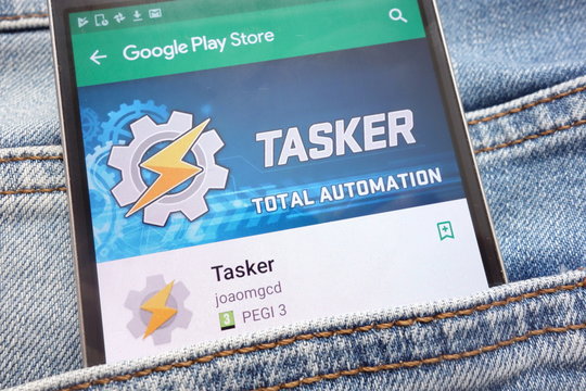 KONSKIE, POLAND - JUNE 12, 2018: Tasker app on Google Play Store website displayed on smartphone hidden in jeans pocket