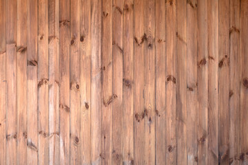 Yellow wall with wooden boards, background or texture