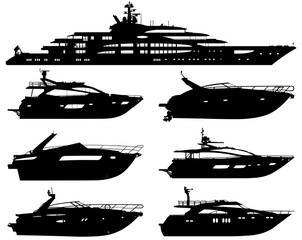 Group of silhouettes of motor yachts isolated on a white background.