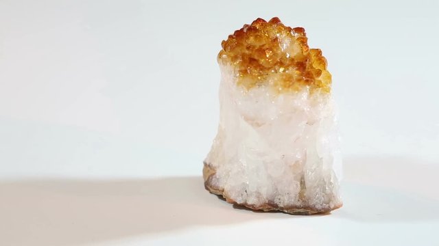 video with rotate small yellow citrine crystals