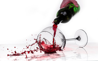 broken wine glass on a quilted table on white background