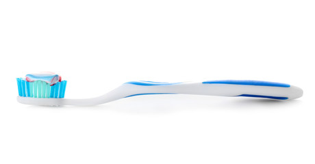 Tooth brush with paste on white background