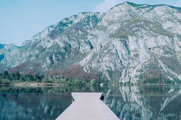 Wooden bridge on the Bohinj lake. The Triglav National Park, Julian Alps, Slovenia.