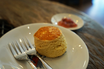 Close up Butter plain scone served with berry jam