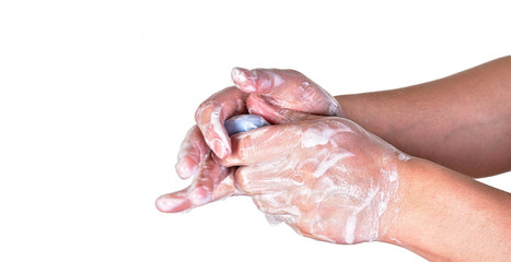 Young man washing hands with blue soap bar, isolated on white. Can be used during coronavirus covid-19 outbreak prevention