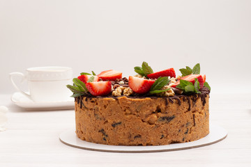 cake anthill with strawberries and nuts