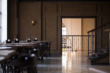 Vintage room cafe or restaurant. Tables opposite the window.