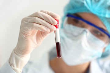 Doctor working with blood samples in laboratory