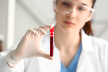 Doctor working with blood samples in laboratory
