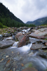 Beautiful landscape of rapids on a mountain river. Long exposure image. Fagaras Mountains.Transylvania. Romania. Wild nature relaxing background.