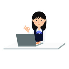 パソコンの前でOKサインをする若い女性社員