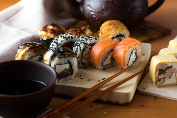 Rolls on a wooden Board. Japanese food on the table