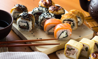 Rolls on a wooden Board. Japanese food on the table