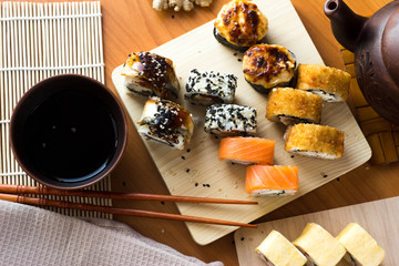 Rolls on a wooden Board. Japanese food on the table