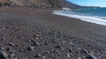 Red sand beach, El Verodal on the Island of El Hierro.