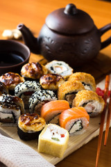 Rolls on a wooden Board. Japanese food on the table