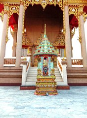 Church of Buddhist temple isolated on blue sky background closeup. Is a place religious ceremonies for Thailand people culture.