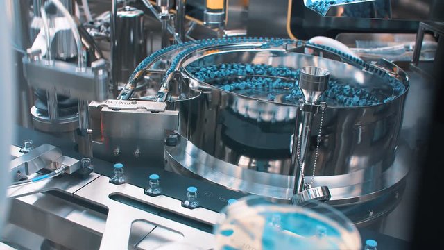 Sterile bottles and vials on the line of the pharmaceutical plant for the production of medical drugs, Medicine, pharmaceuticals, Covid-19.