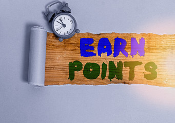 Writing note showing Earn Points. Business concept for collecting scores in order qualify to win...