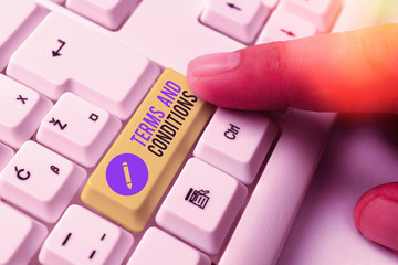 Writing note showing Terms And Conditions. Business concept for rules that apply to fulfilling a...