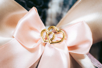 heart shaped jewelry with pink ribbons