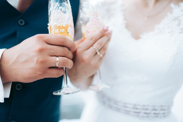 bride and groom holding glass of champagne