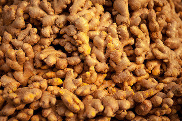 Fresh Ginger Roots on a counter in the market. Selective focus