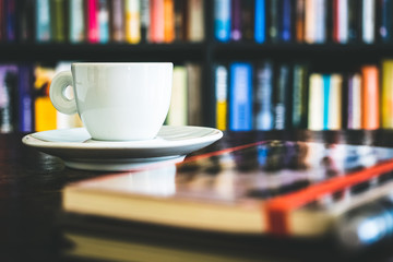 Cup of coffee and books