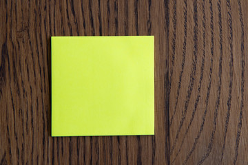 Colorful sticky notes on wooden background image.