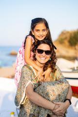 Mother and daughter on the beach