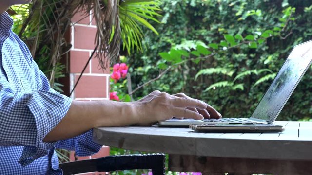 Businessman typing on his cellphone at home. Home office or work from home concept.