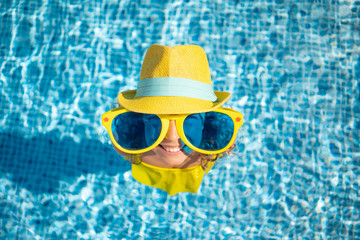 Happy child in swimming pool