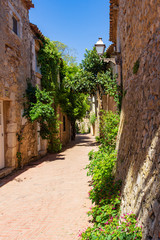 Fototapeta na wymiar Street in the historic center of the town of Saint Marti of Ampuries, Costa Brava, Catalonia, Spain