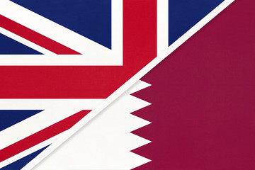 United Kingdom vs Qatar national flag from textile. Relationship between two european and asian countries.