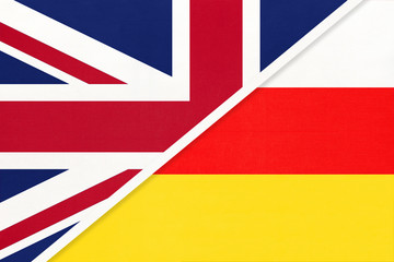 United Kingdom vs South Ossetia national flag from textile. Relationship between two european and asian countries.