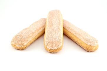 Fototapeta na wymiar Savoiardi biscuits, also known as Ladyfingers,on white background. They are sweet sponge cookies used also in many desserts
