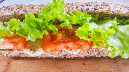 Diet sandwich with vegetables, salad and tofu in close-up