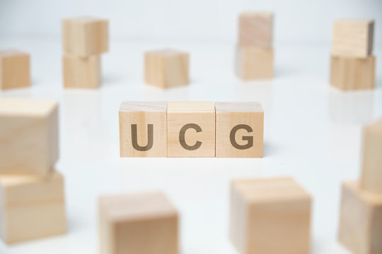 Wooden blocks on a white background with the inscription - ucg.