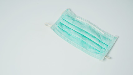 Disposable Ear- loop face mask on white background.