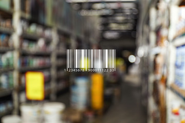 Barcode and blurred view of modern wholesale warehouse