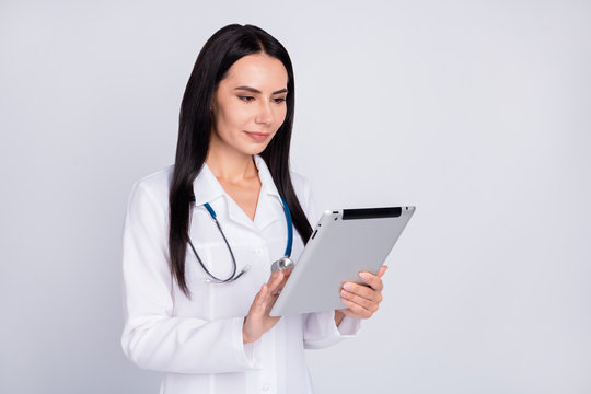 Photo of beautiful professional doc lady writing patient digital contract insurance in e-book modern technology concept wear stethoscope white lab coat isolated grey color background