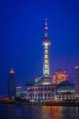 Shanghai, China - July 4, 2011 : Business center of Shanghai as seen from the river at night (vertical)