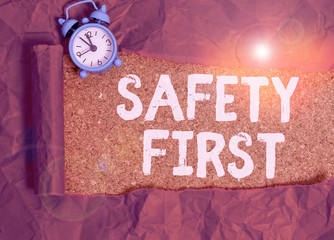 Writing note showing Safety First. Business concept for used to say that the most important thing...
