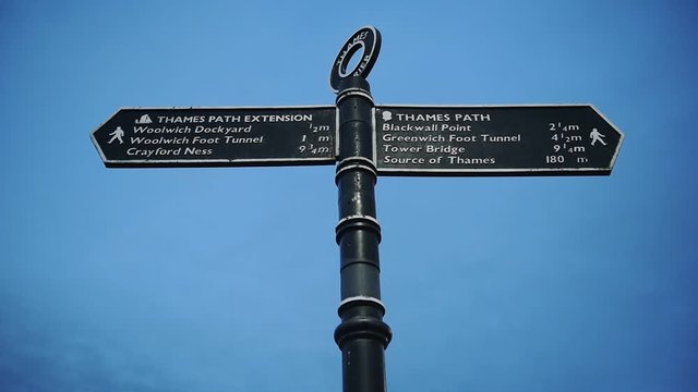 The Black Signpost Showing The Way To Thames Path And Thames Path Extension In London, England. -wide shot