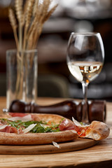 pizza with jamon and herbs